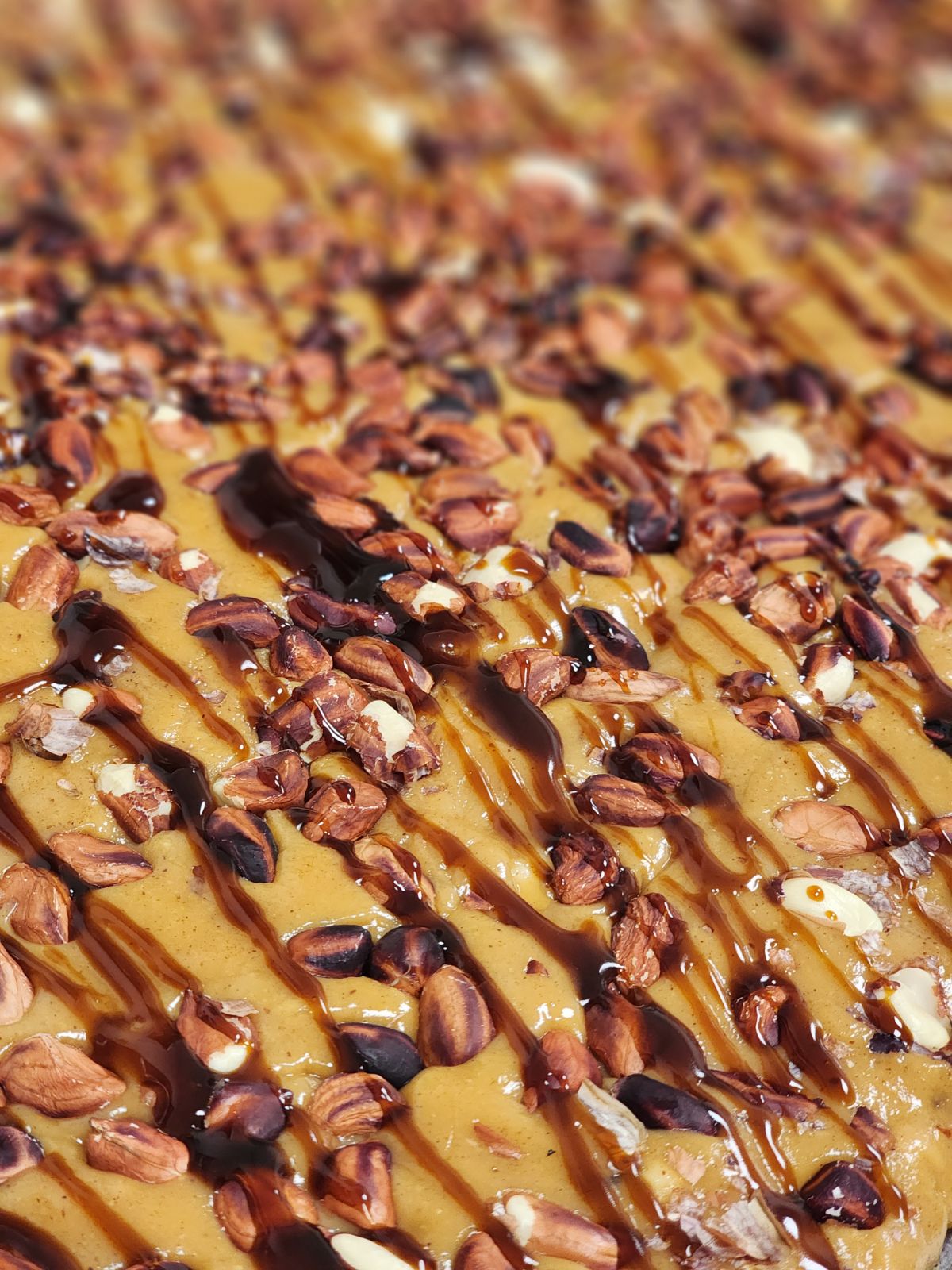 close up of peanut butter taffy and peanuts