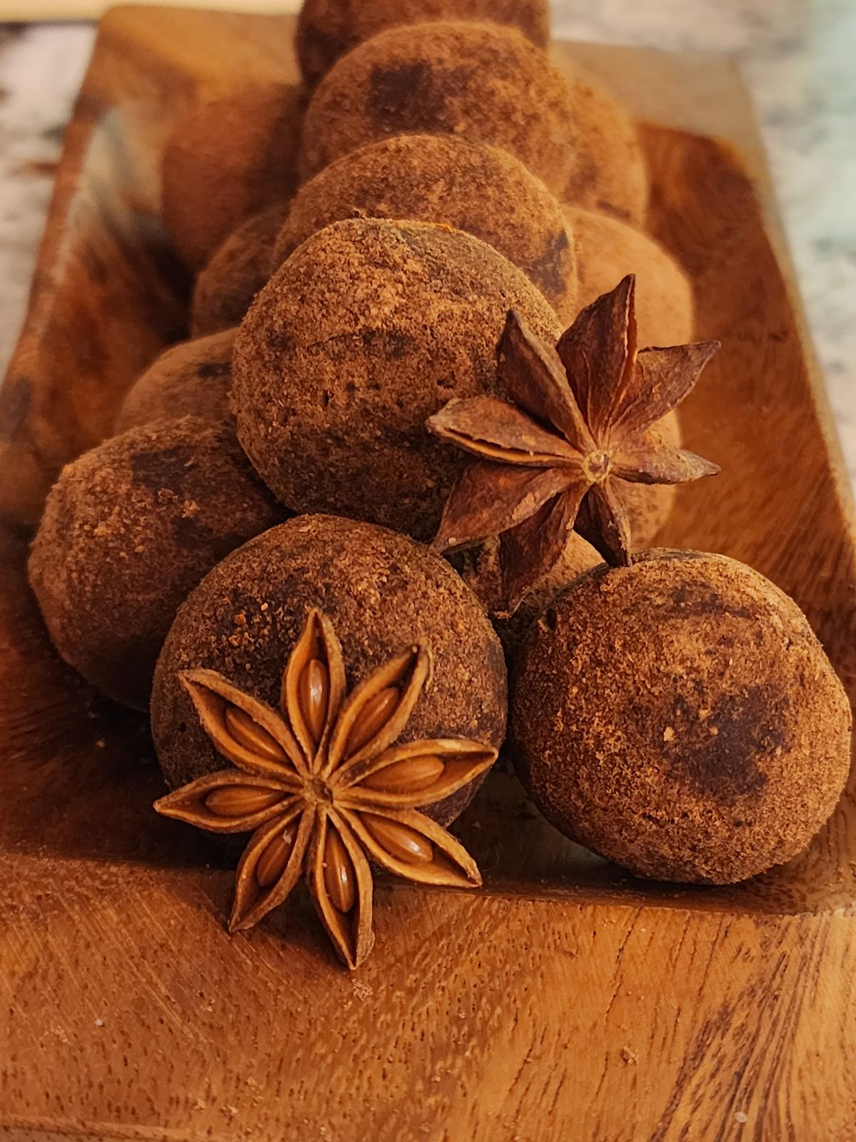 anise flower in front of chai truffles